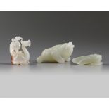 A group of Chinese white and pale celadon jade mythical beast carvings