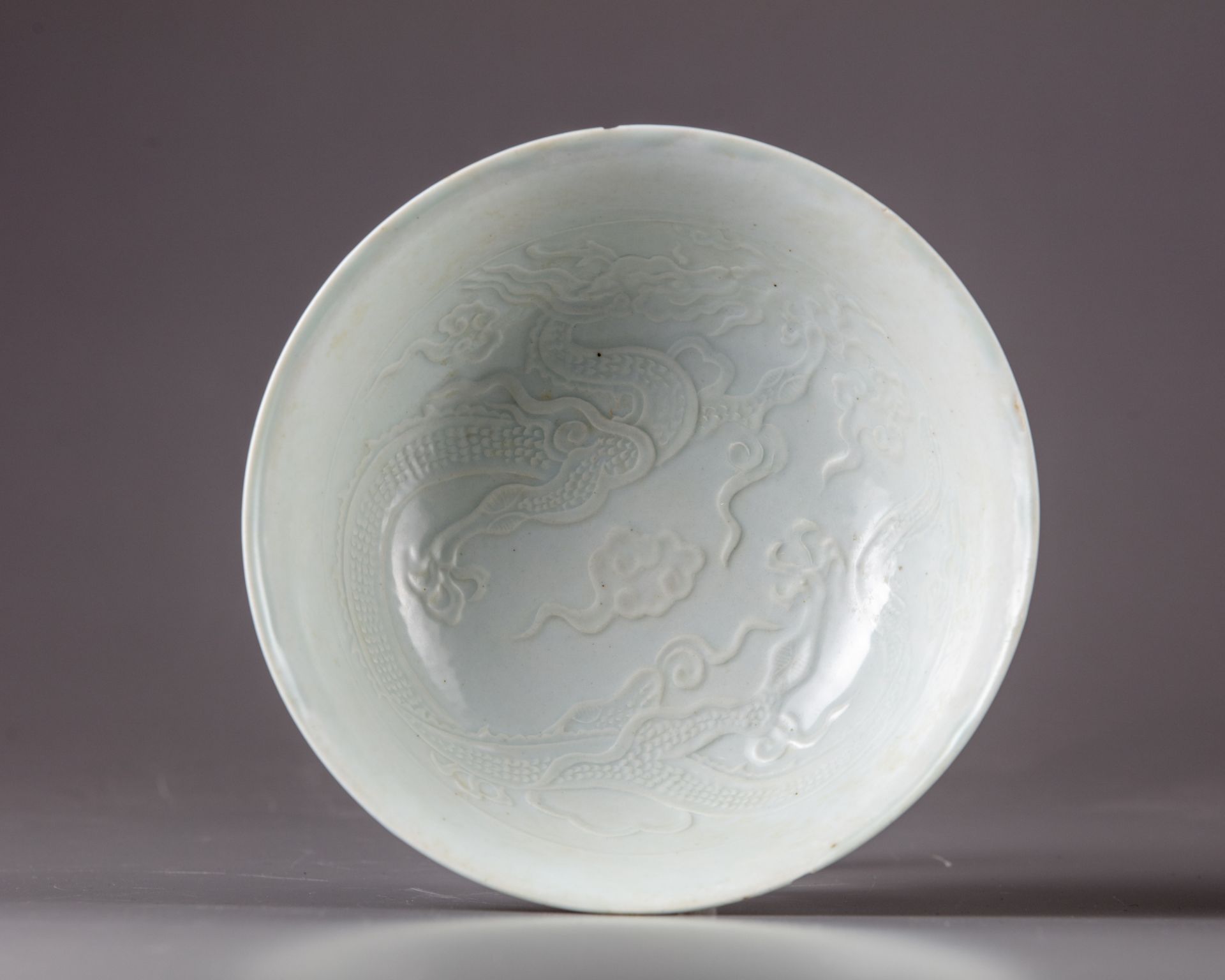 A white glazed 'dragon' bowl