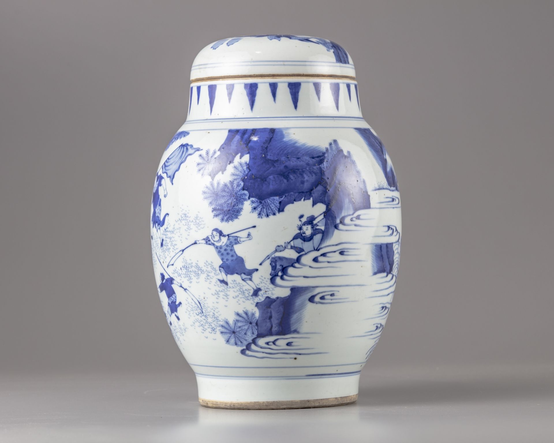 A blue and white pot and cover