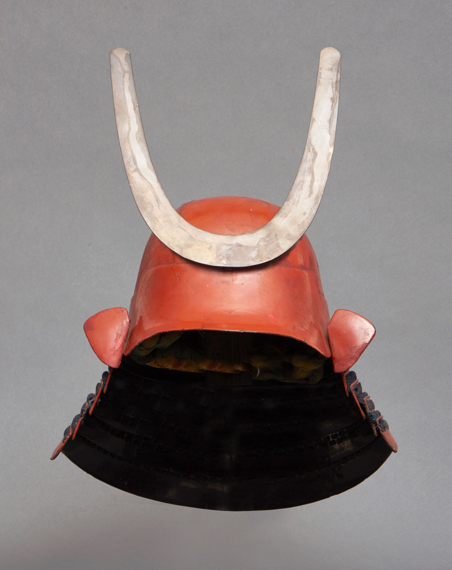 A Japanese red lacquered head-shaped six plate zunarikabuto-helmet