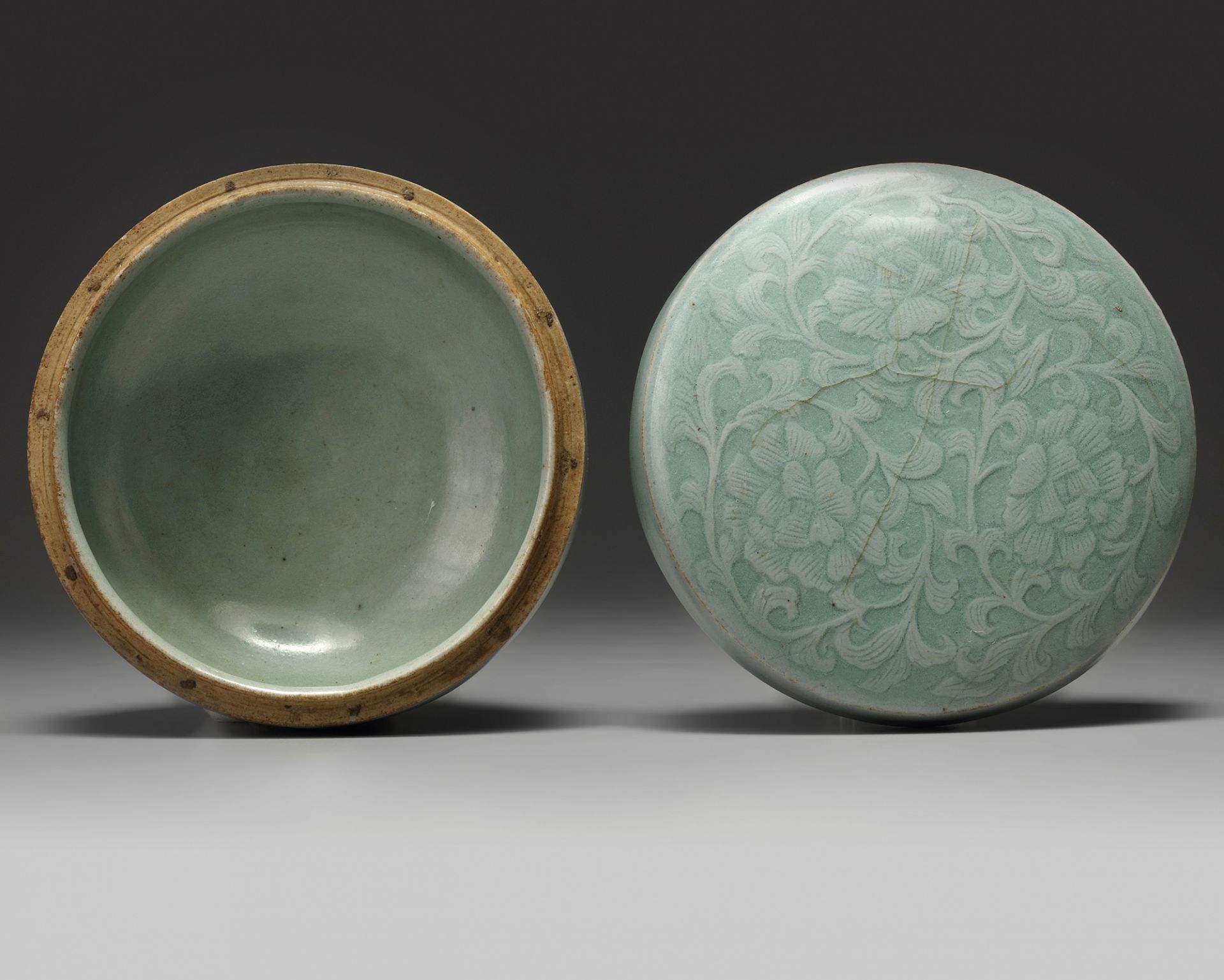 A Korean celadon-glazed ‘peonies’ round box and cover