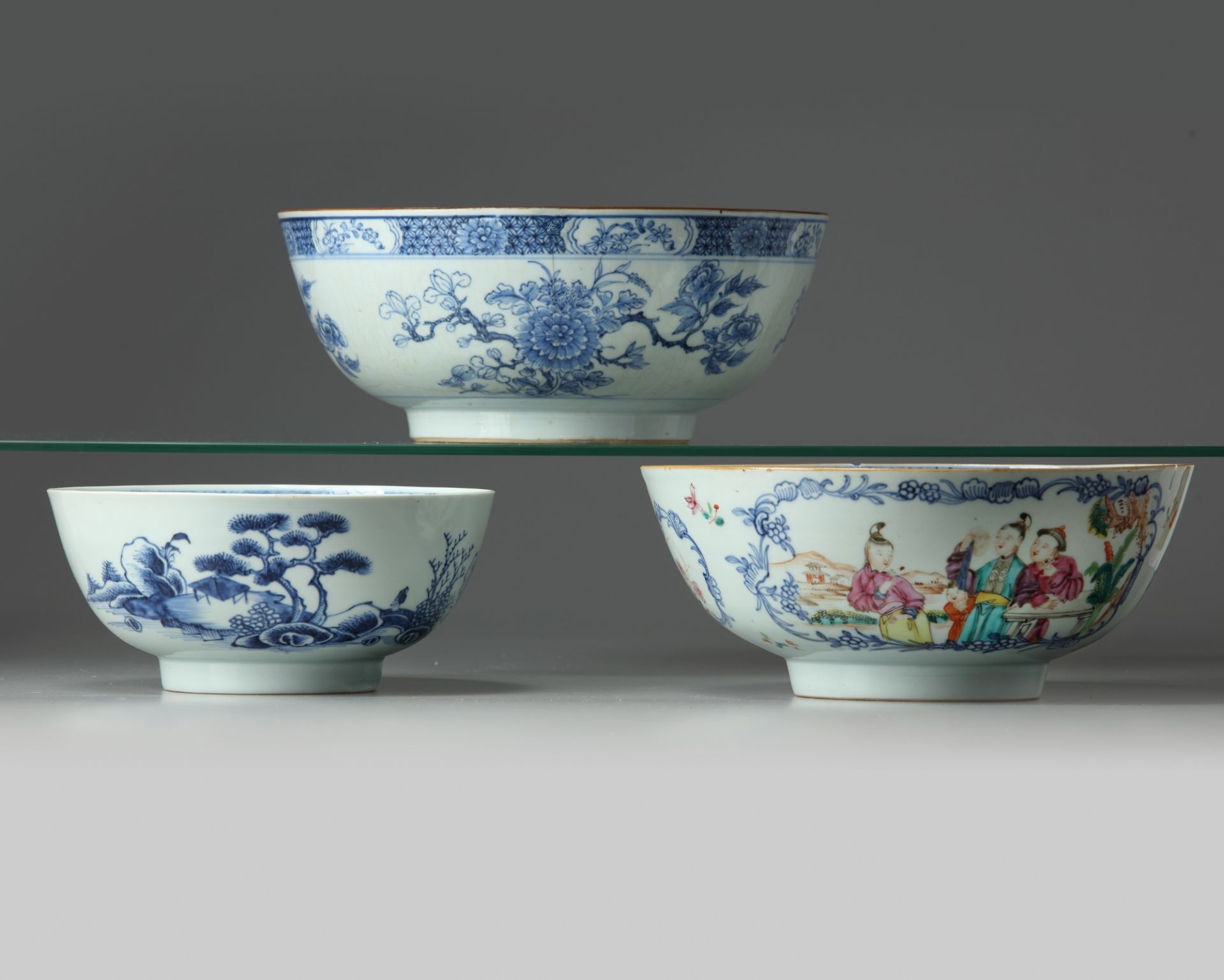 Two Chinese blue and white bowls and a famille rose bowl