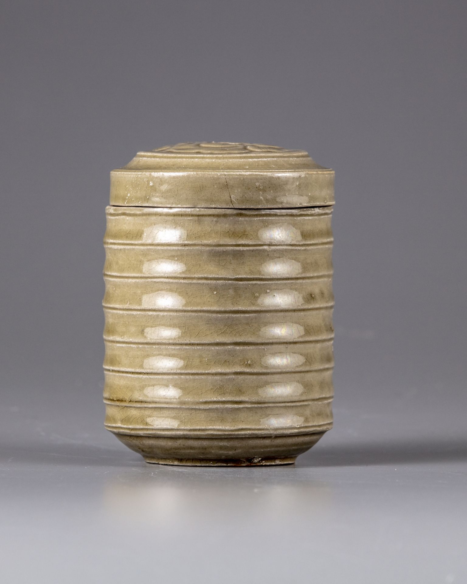 A Chinese celadon-glazed jar and cover