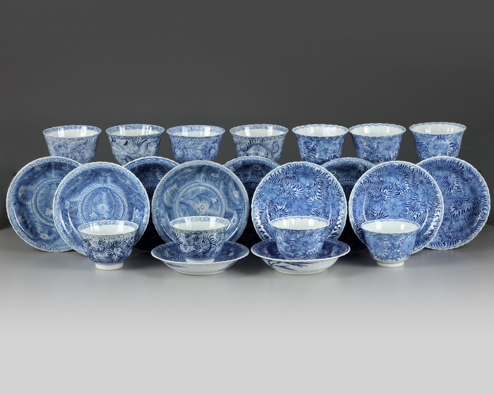 A set and a matched set of Chinese blue and white flower scroll cups and saucers - Image 2 of 4
