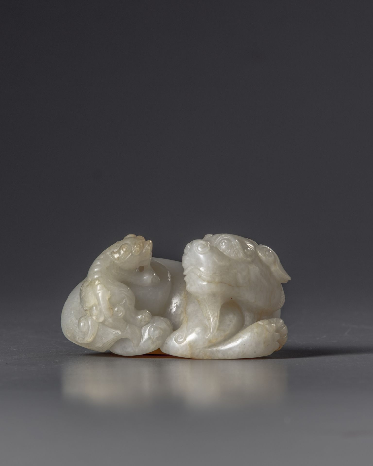 A Chinese jade carving of a Buddhist lion