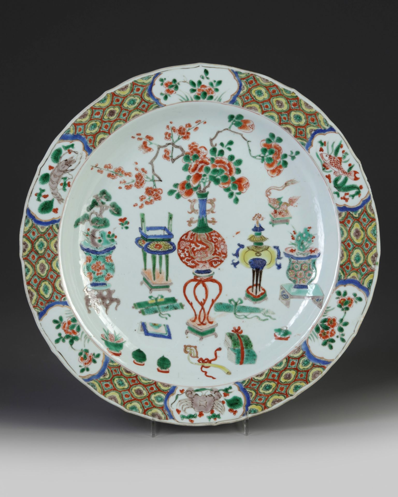 A Chinese famille verte 'precious objects' charger