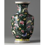 A Chinese famille noir 'butterfly and flowers' vase