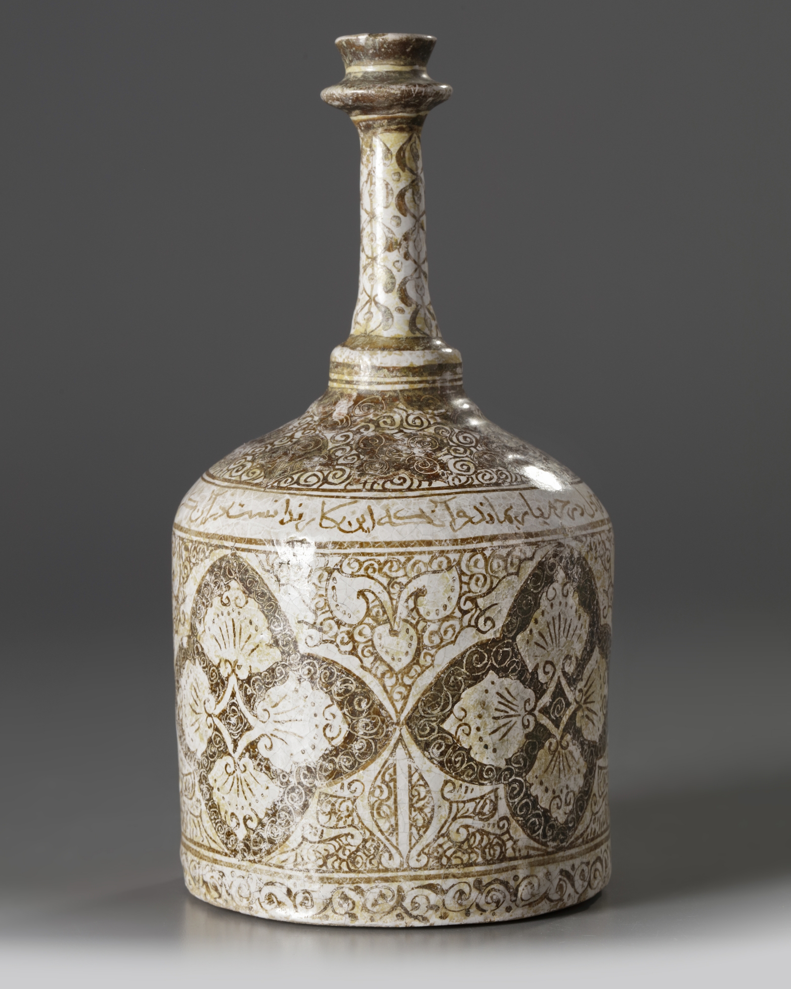 An Islamic Kashan pottery bottle vase
