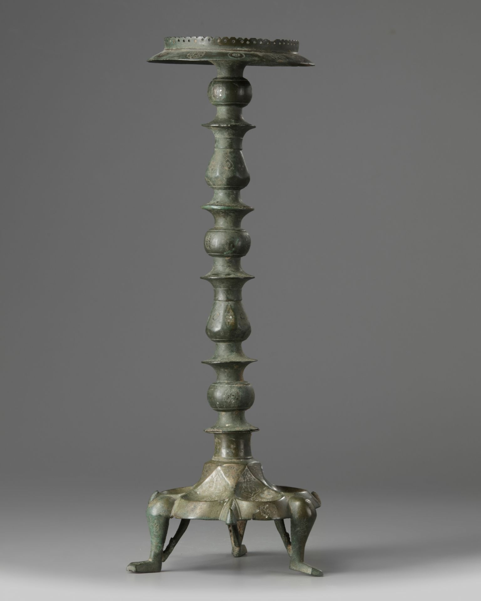 An Islamic bronze oil lamp stand