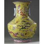 A Chinese yellow-ground famille rose 'nine dragon' vase, hu