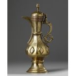 An Islamic brass teapot with six sided body