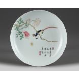 A Chinese famille rose ruby-back 'bird and flower' dish