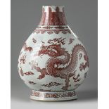 A Chinese underglaze copper-red and blue decorated 'dragon' vase