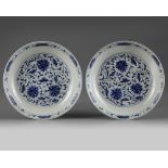 A pair of Chinese blue and white 'lotus' dishes