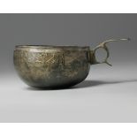 A bronze Seljuq cup with handle