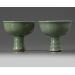 A similar pair of Chinese celadon glazed stem cups