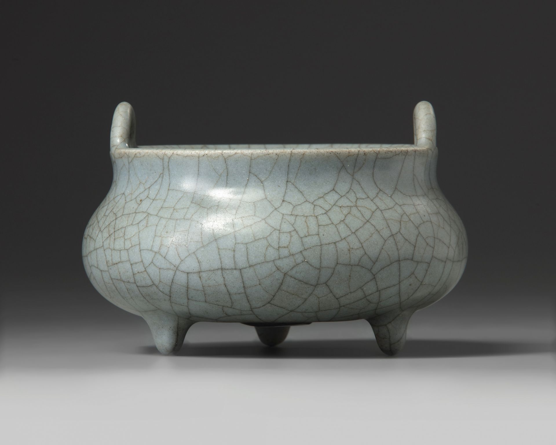 A Chinese grey crackle-glazed tripod censer