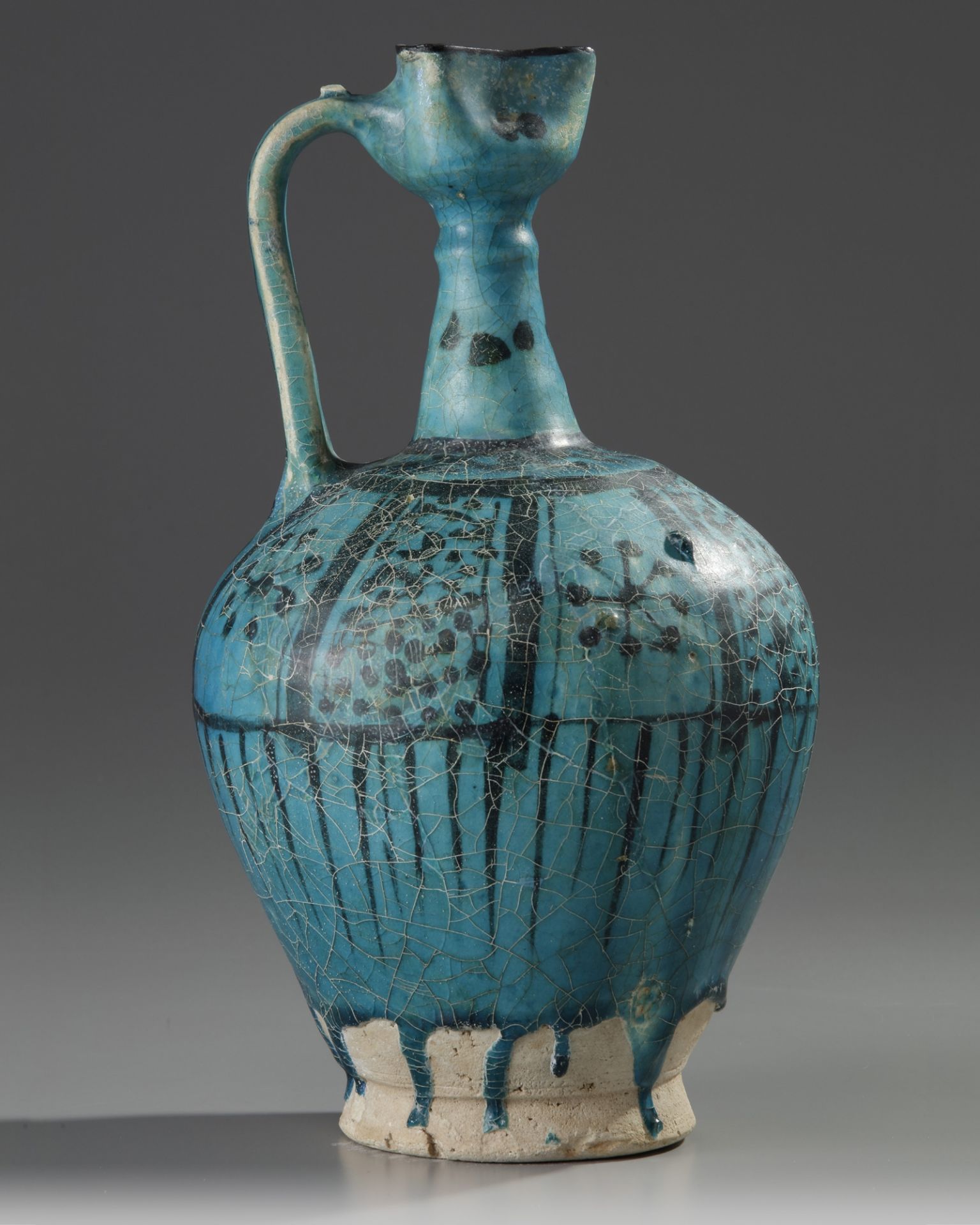 An Islamic pottery ewer