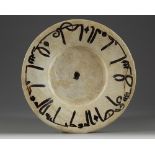 A slip-painted calligraphic pottery dish