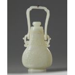 A Chinese white jade hanging vase and cover
