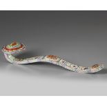 A Chinese famille rose moulded ruyi sceptre