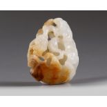A Chinese white and russet jade 'bat and lingzhi' carving