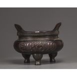 A Chinese large bronze Islamic-market tripod censer