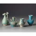 Four Islamic turquoise glazed jugs
