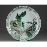 A Chinese famille verte 'dragon & warrior' charger