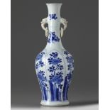 A Chinese blue and white twin-handled slender vase