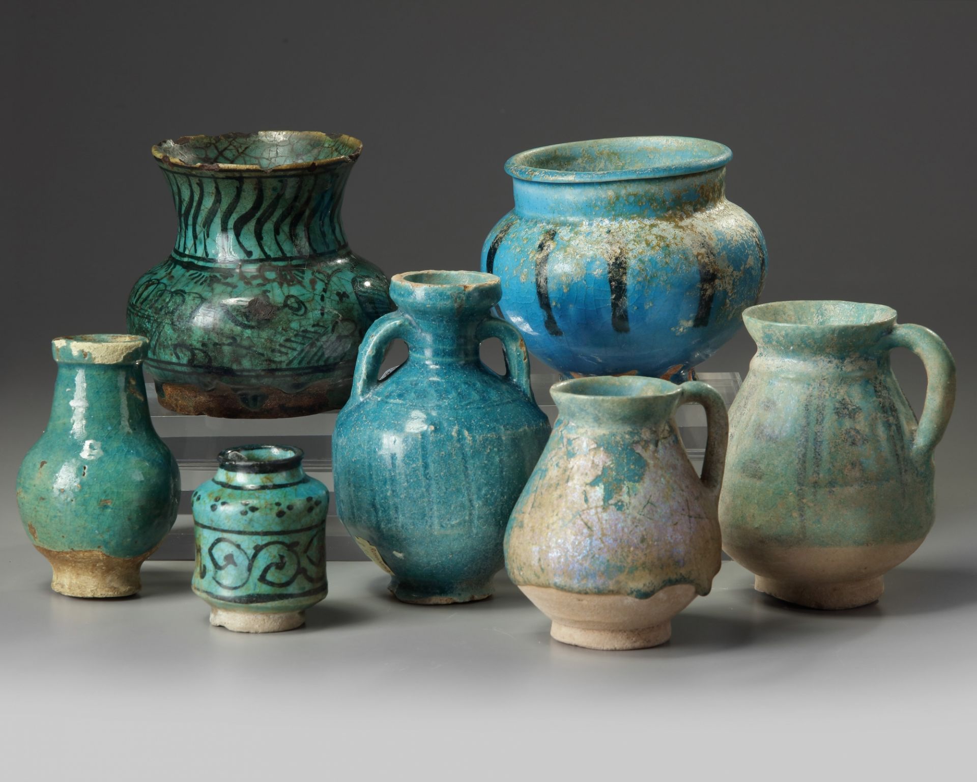 A group of seven Islamic turquoise glazed objects