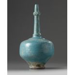 An Islamic turquoise glazed bottle vase