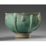 An Islamic turquoise glazed stem-bowl