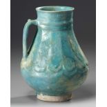 An Islamic turquoise glazed jug