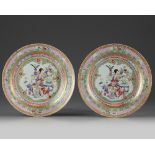 A pair of Chinese ruby-back famille rose 'lady and boys' dishes