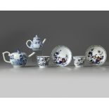 A group of Chinese blue and white teapots, cups, and saucers