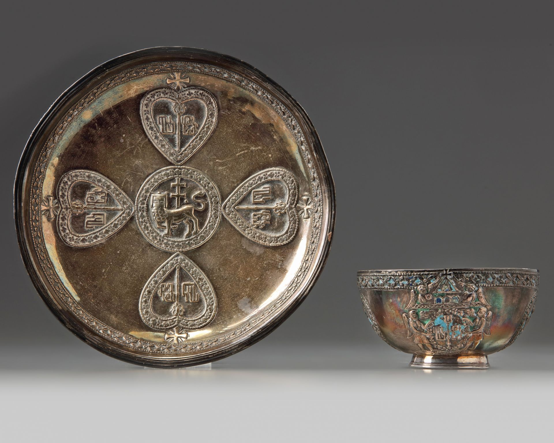 A rare Armenian enamelled silver cup and saucer