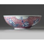 A Chinese puce-enamelled blue and white 'Immortals' bowl