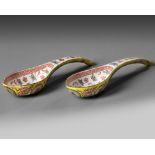 A pair of Chinese yellow-ground famille rose ‘birthday’ spoons