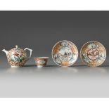 A Chinese gilt and famille rose-decorated cups and saucers and a Meissen 'Chinoiserie' teapot