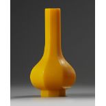 A Chinese yellow-glass octagonal bottle vase