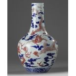 A Chinese underglaze copper-red and blue decorated 'dragon' vase