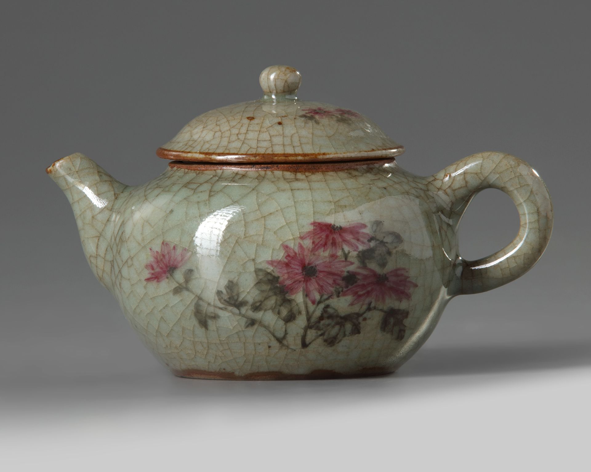 A Chinese crackle-glazed famille rose teapot and cover