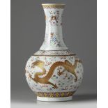 A Chinese famille rose 'dragon' bottle vase