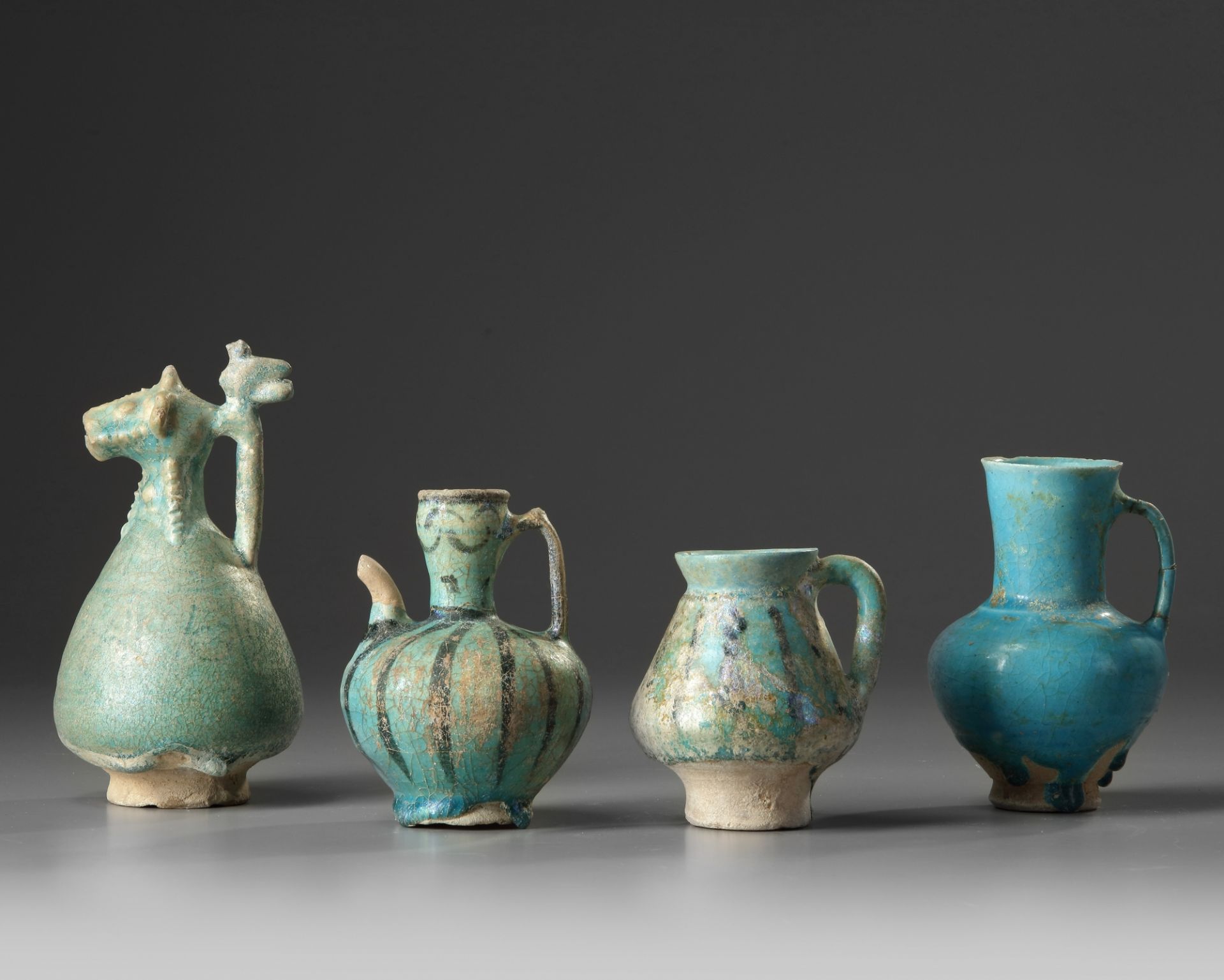 Four Islamic turquoise glazed jugs - Image 2 of 2