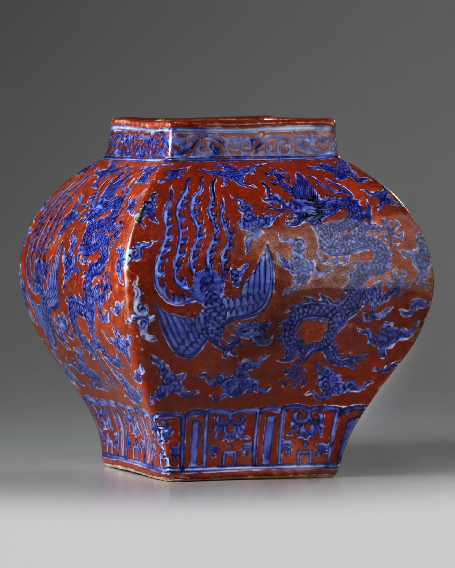 A Chinese iron-red-ground 'dragon and phoenix' square-section jar