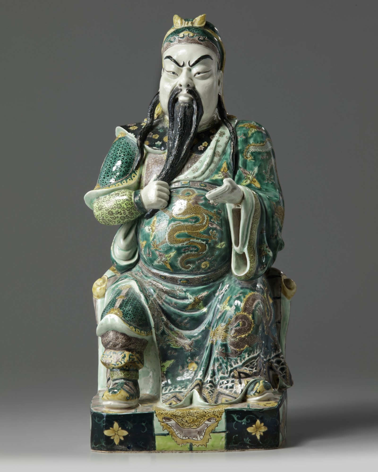 A Chinese famille verte biscuit figure of Guandi