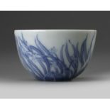 A small Chinese blue and white 'orchid' cup