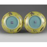 A pair of Chinese lime-green ground famille rose 'sgraffiato' dishes