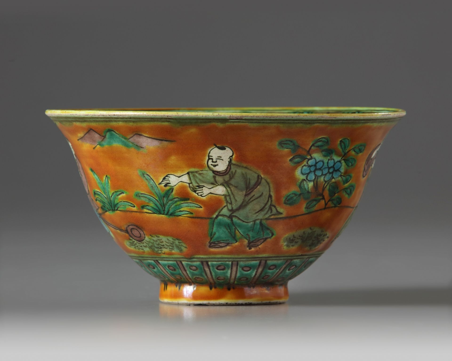 A Chinese amber-ground turquoise, aubergine, and green-glazed bowl